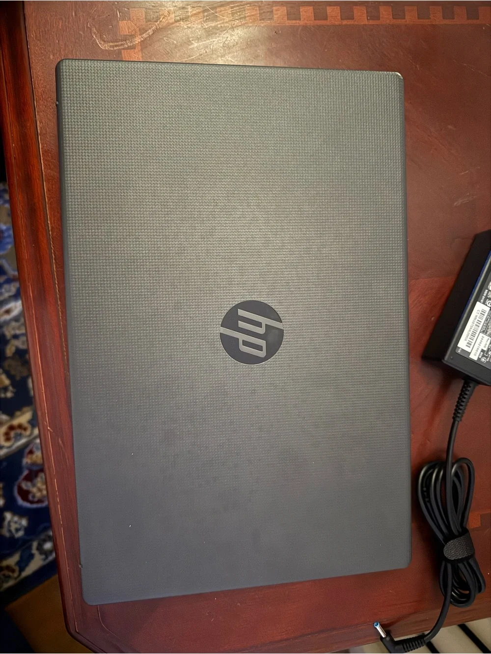 HP Laptop in Dark Gray with Charger and Setup Guide
